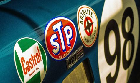 Sponsor stickers on the side of a race car.
