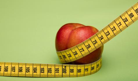 tape measure surrounding an apple