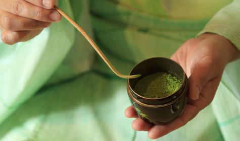 A person presenting matcha at a tea ceremony