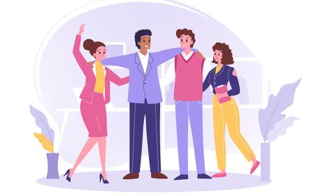 A business team gathering for a group hug