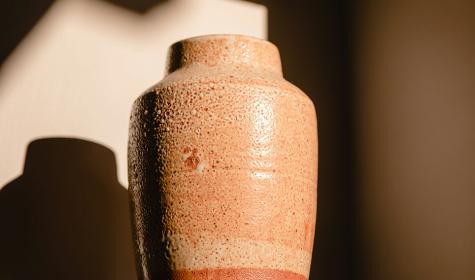 An urn standing in the shadows